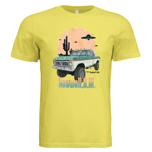 Yellow t-shirt with a graphic of a truck and desert scene on a white background