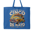 Blue tote bag with a vintage car graphic and 'Cinco de Mayo' text on a white background